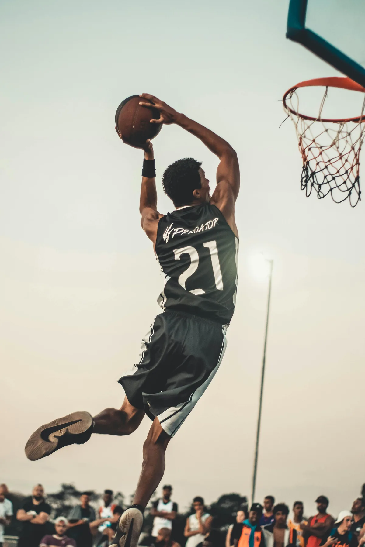 A basketball player rising for a dunk