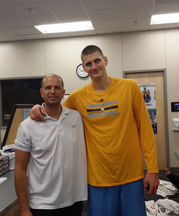 Nikola Jokić with Tamir Kfir in the Denver Nuggets locker room